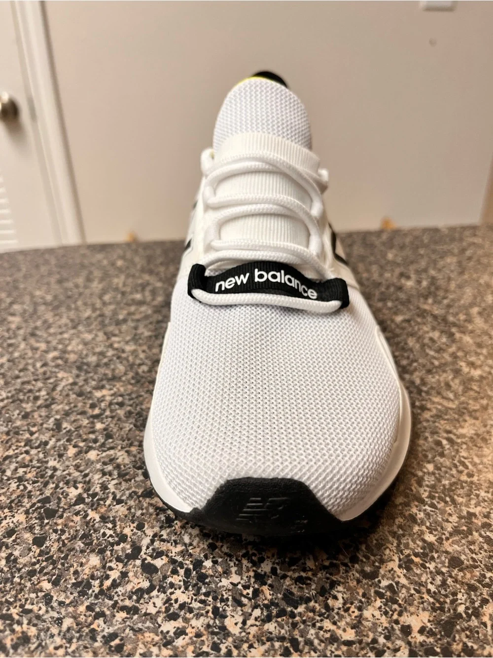 New Balance White Black Athletic Running Shoes with Yellow Accent